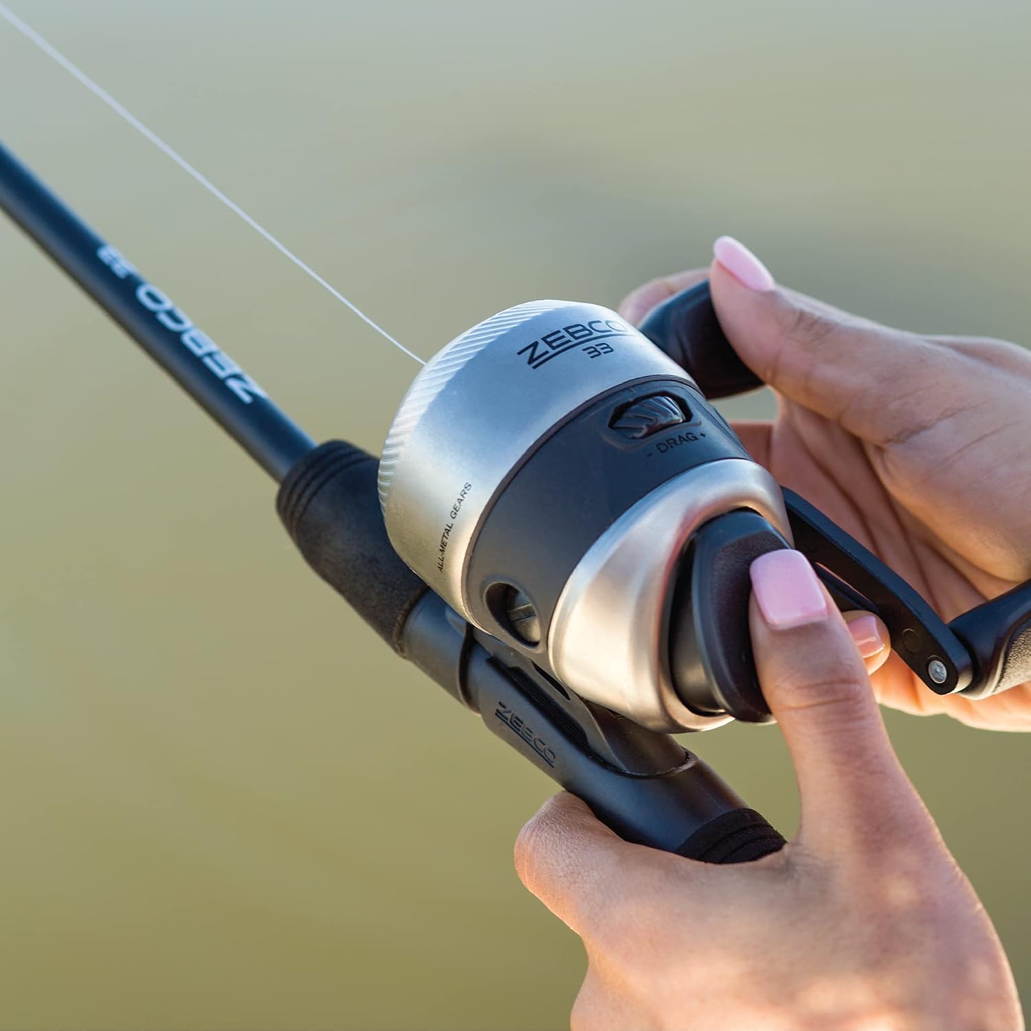 Zebco 33 Spincast Fishing Reel, Size 30 Reel, Right or Left-Hand Retrieve, 10-Pound Zebco Cajun Fishing Line, Graphite Frame Silver/Black - Image 6